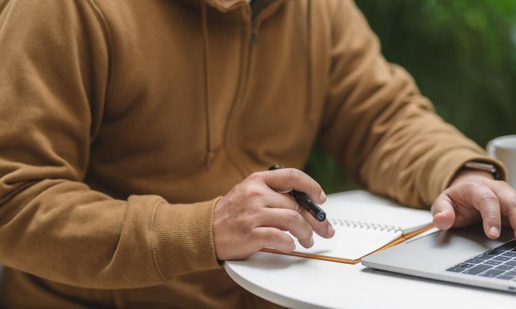 Person In Brown Long Sleeve Shirt Holding Black Pen 3787796