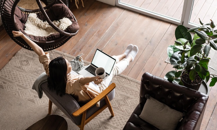 Happy Free Asian Girl Sitting Home With Laptop Coffee Mug Raising Hands Up Min