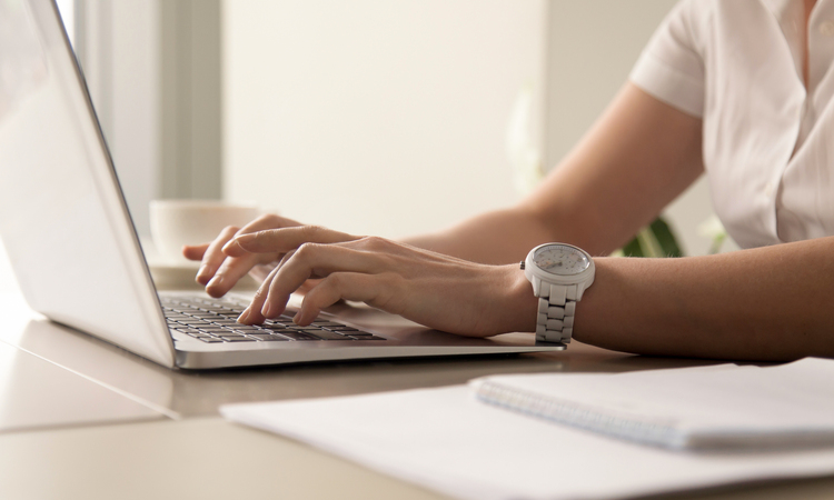 Womans Hands Typing Laptop Workplace