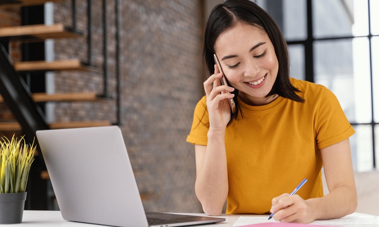 Woman Using Phone While Attending Online Class Min