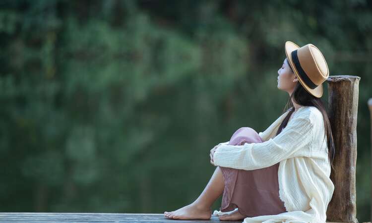 Lonely Woman Sitting Waterfront Raft Min