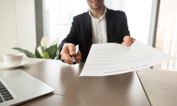 Real Estate Agent Offers Sign Rental Agreement